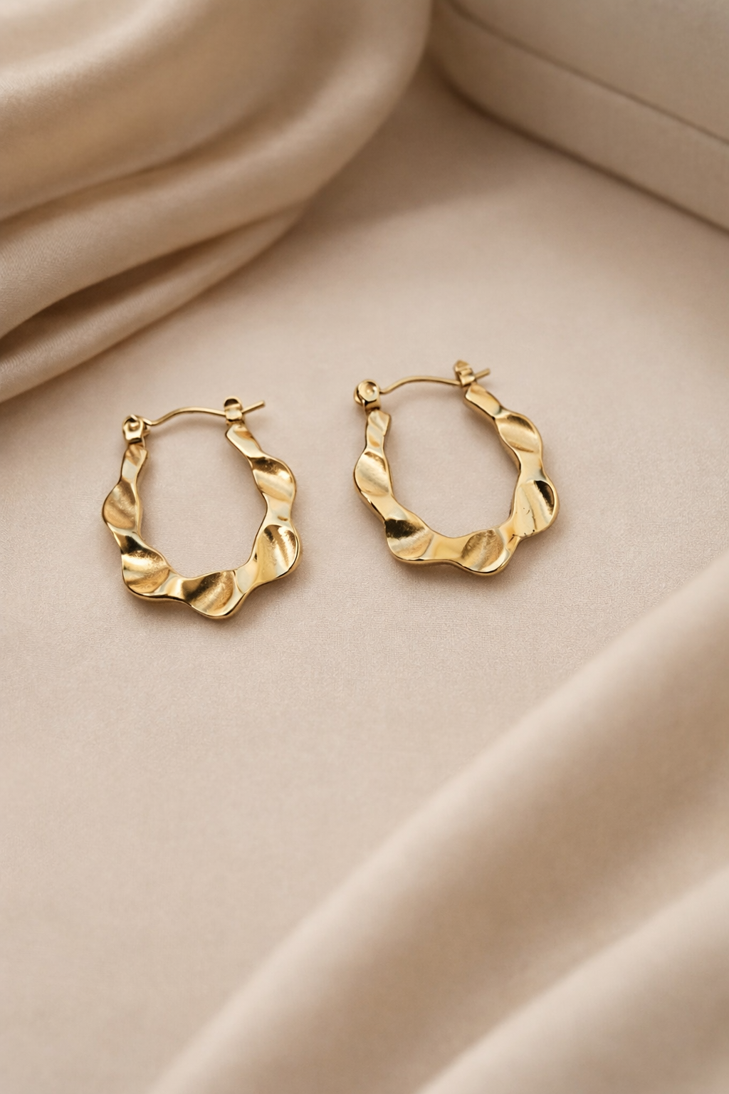 The earings on a cloth background 