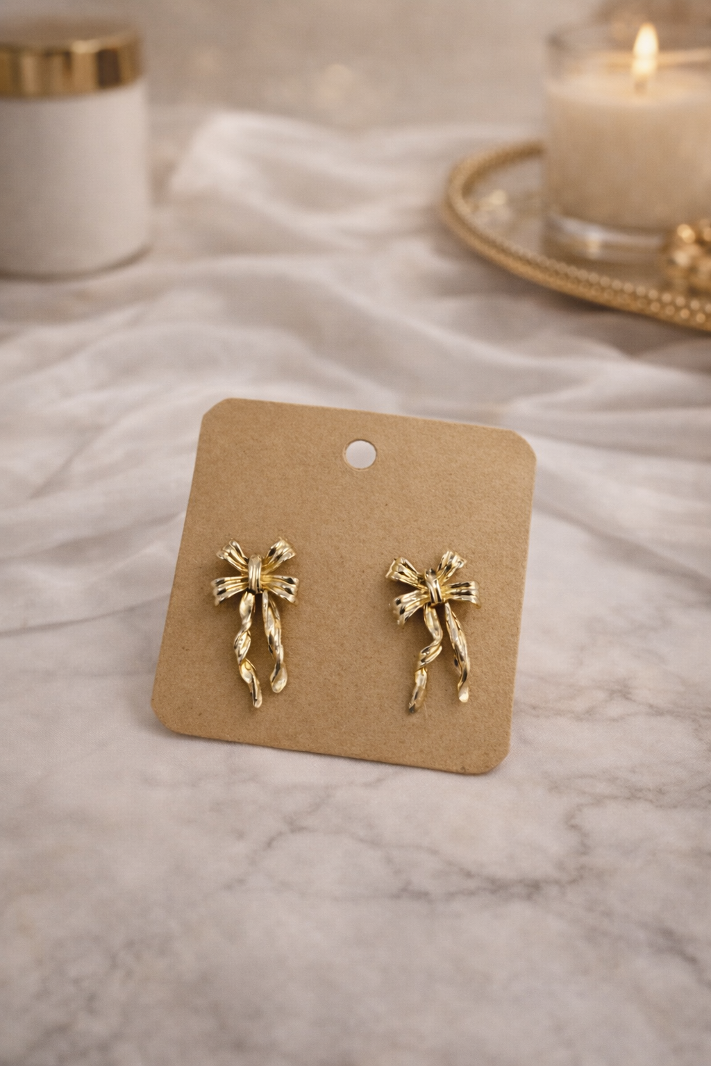 Thea earings on a white marble background 