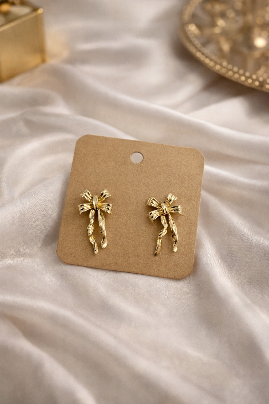 The earings on a white cloth background 