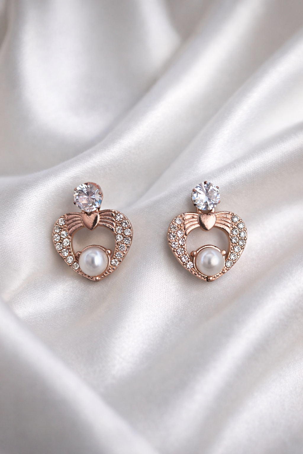 The earings on a white cloth background 