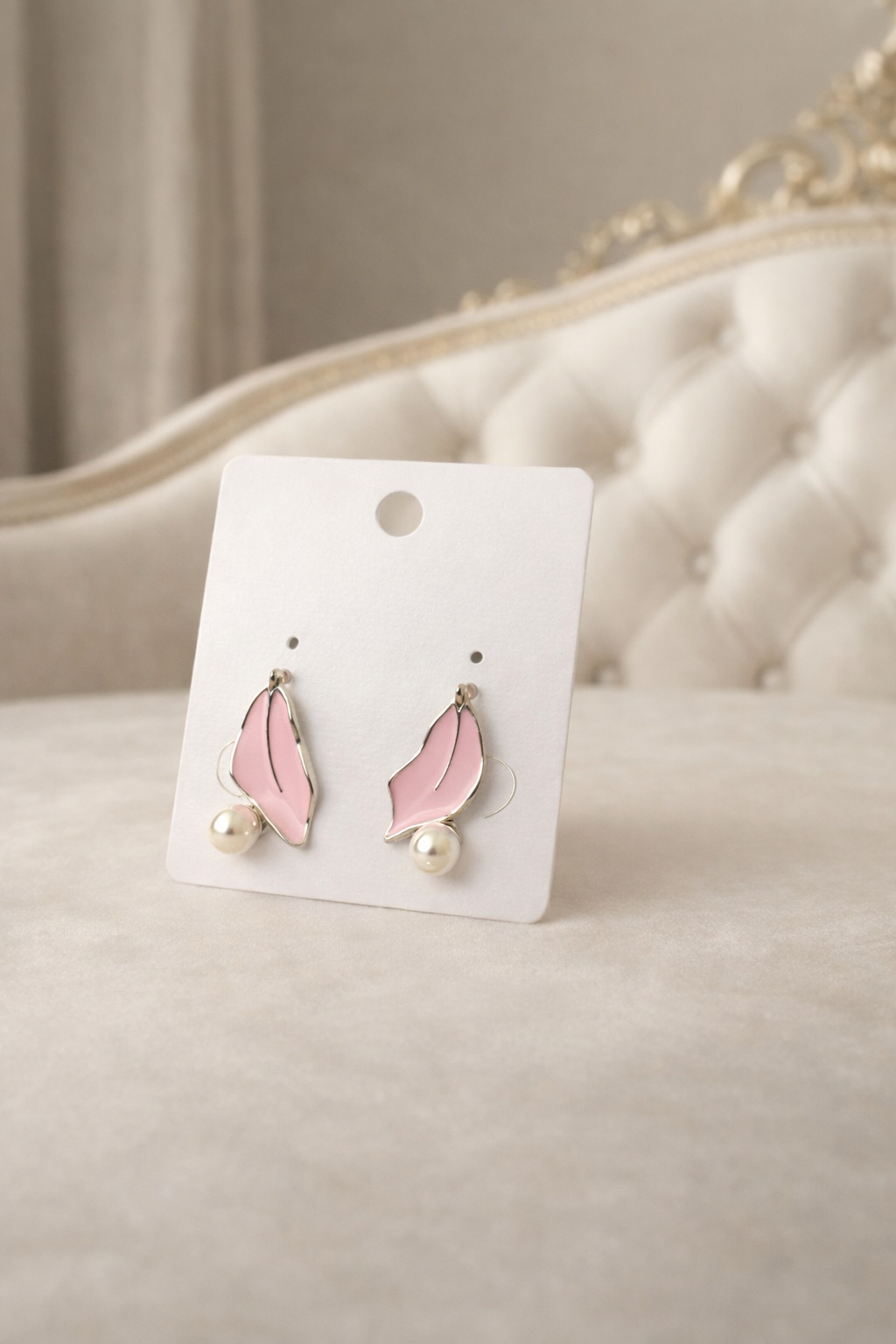 The earrings on a white couch background 