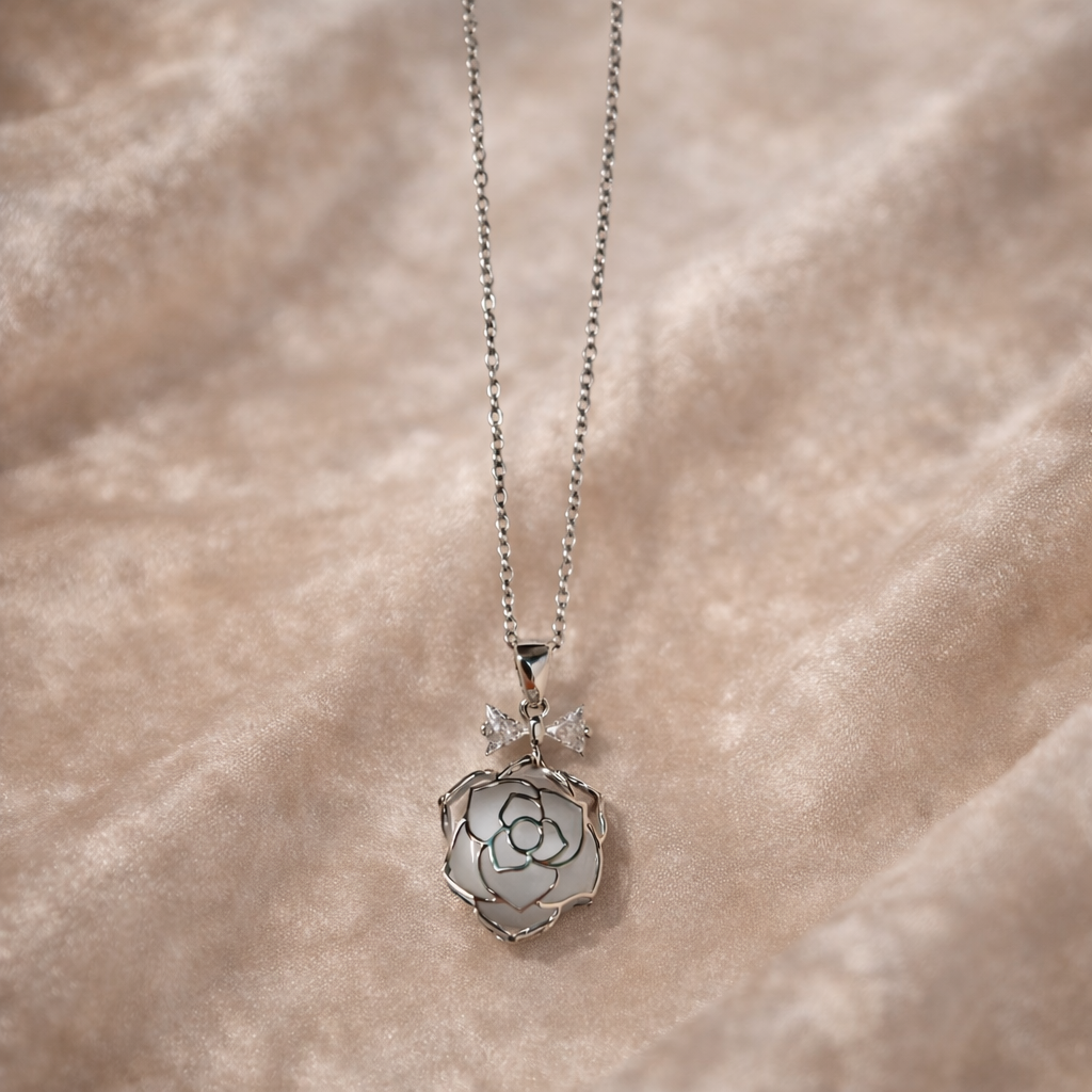 The pendant on a rose background 