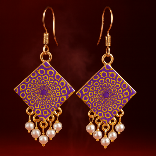 A pair of handcrafted square-shaped dangle earrings featuring intricate purple and gold mandala designs, accented with clusters of small white faux pearls