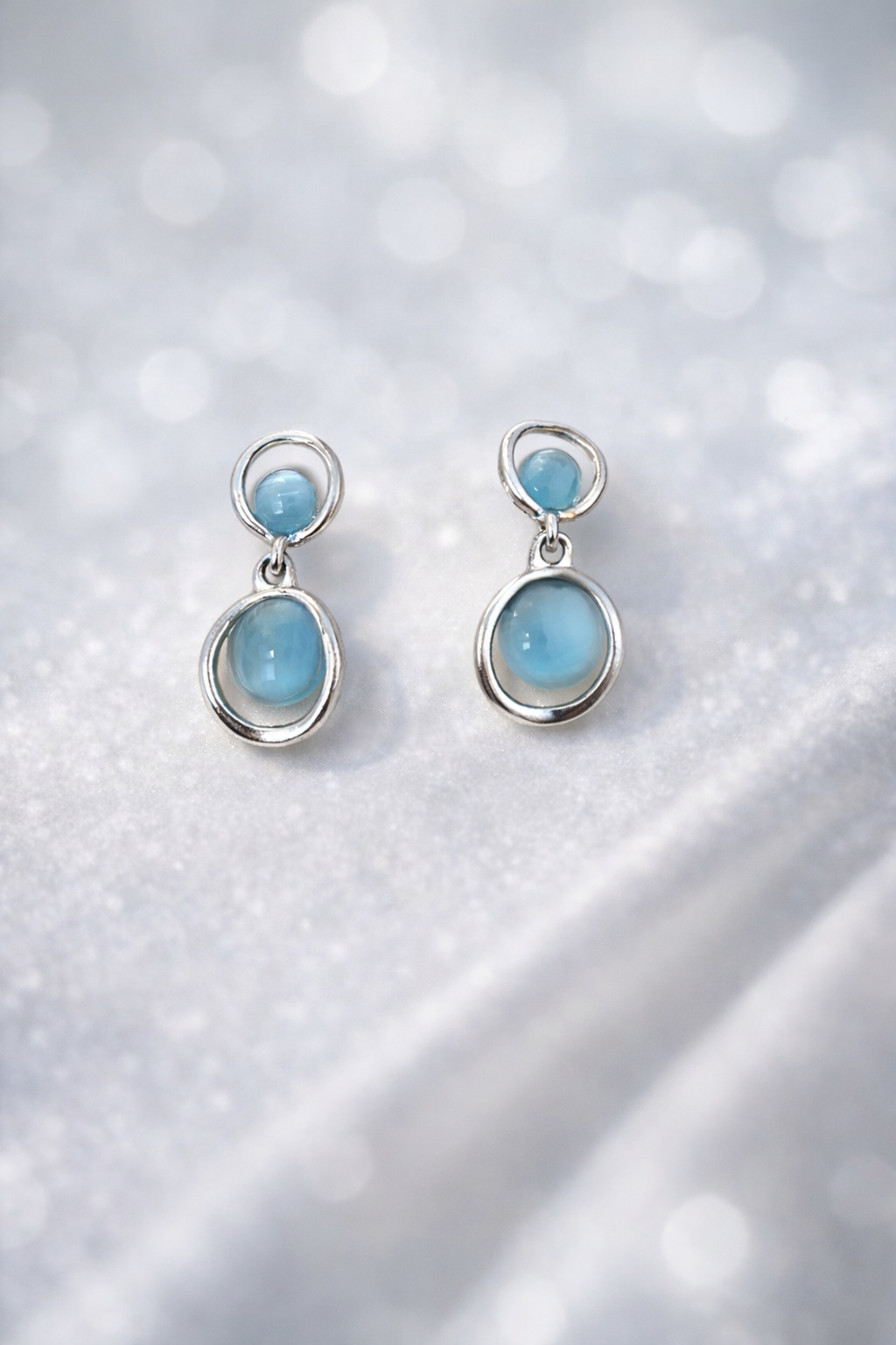 The earrings on a marble background 