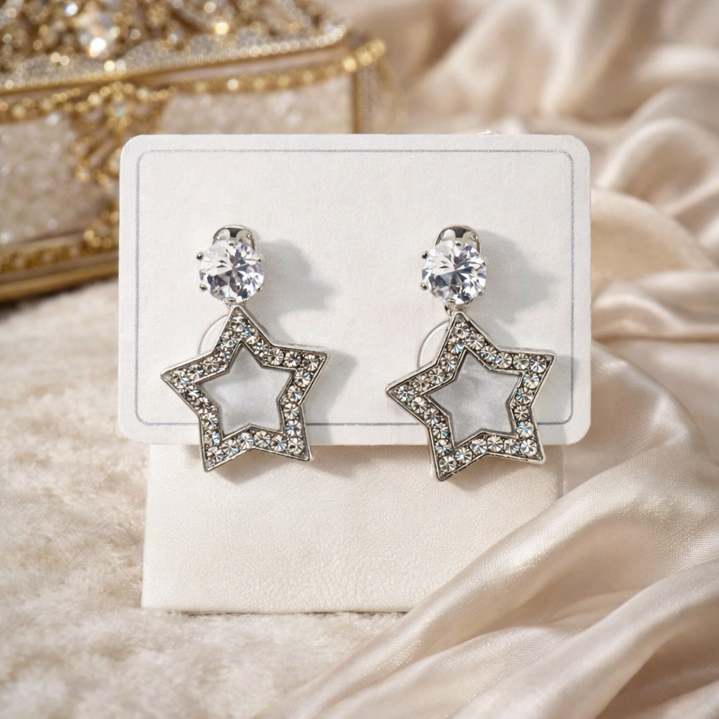 The earings on a rose cloth background 