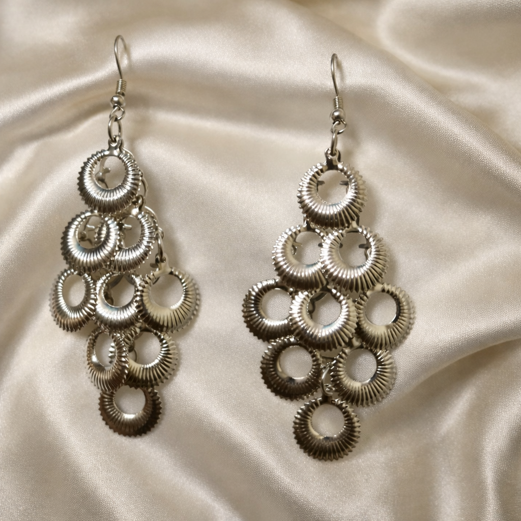 The earrings on a white cloth background 