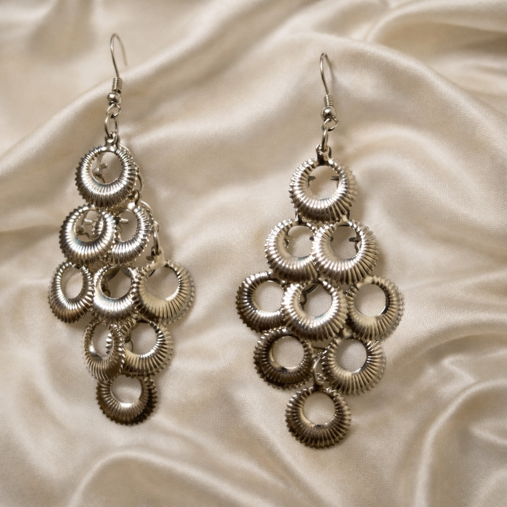 The earrings on a white cloth background 