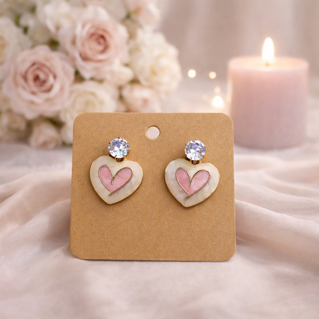 The earrings on a rose cloth background 