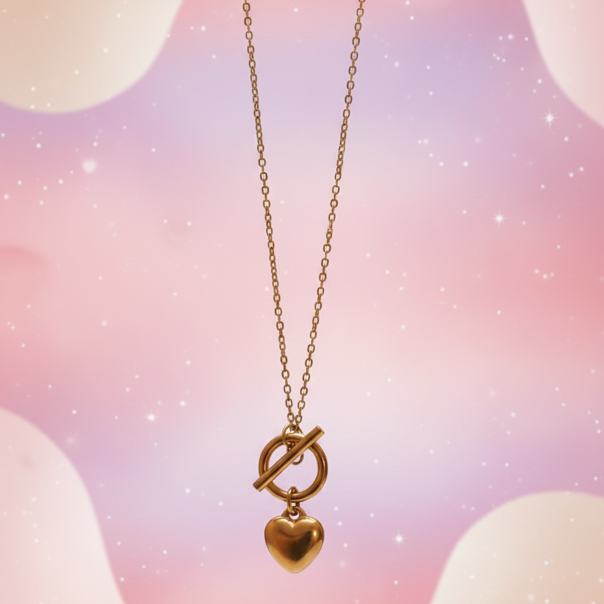 Gold necklace with a heart pendant on a pastel background