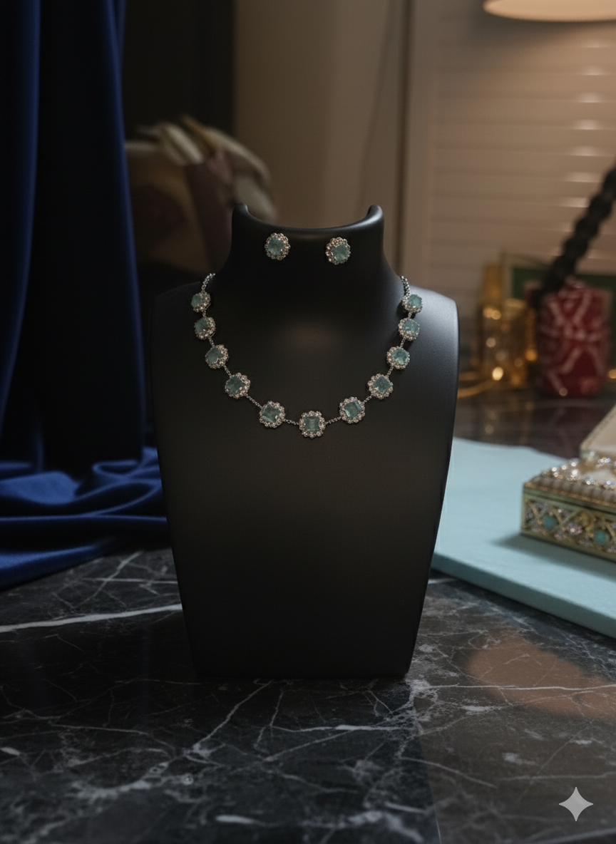 Jewelry set on a black mannequin bust with a blurred background
