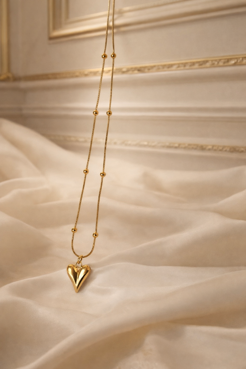 The pendant on a champagne cloth background 