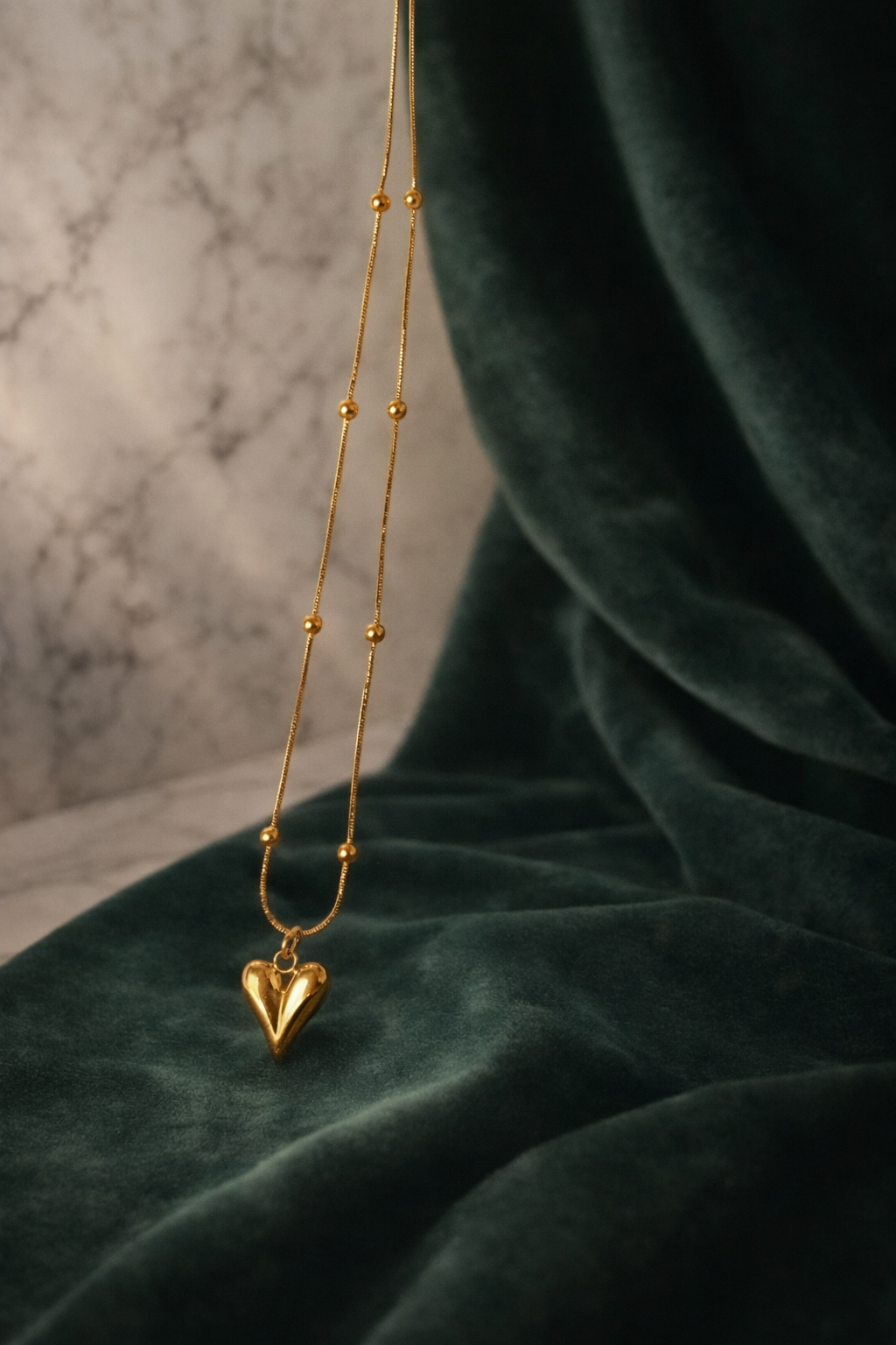 The pendant on a green cloth background 