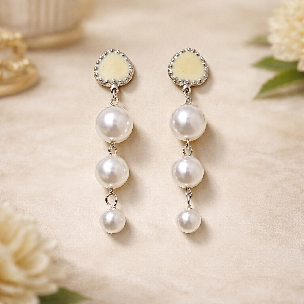 The earrings on a beige background 