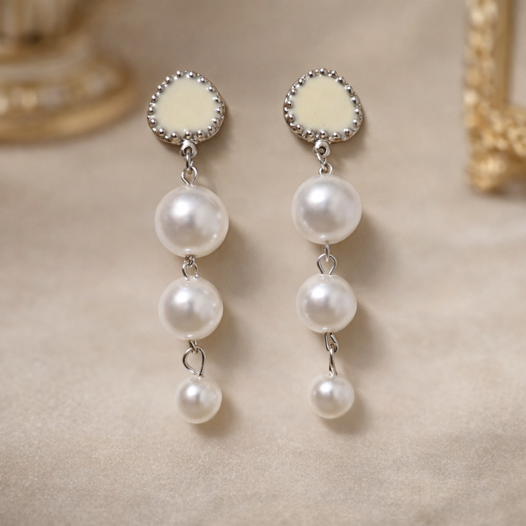 the earrings on a beige background 