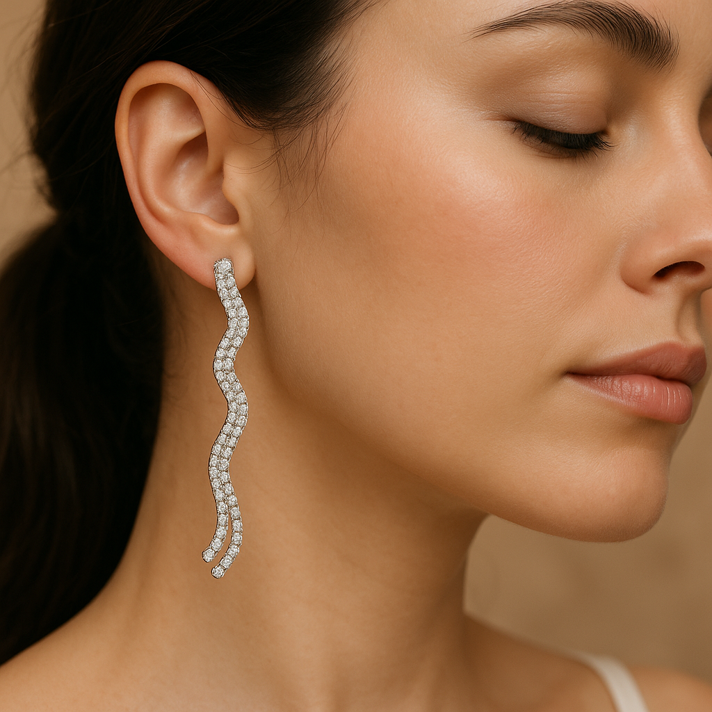 Close-up of a woman wearing a diamond earring with a neutral background