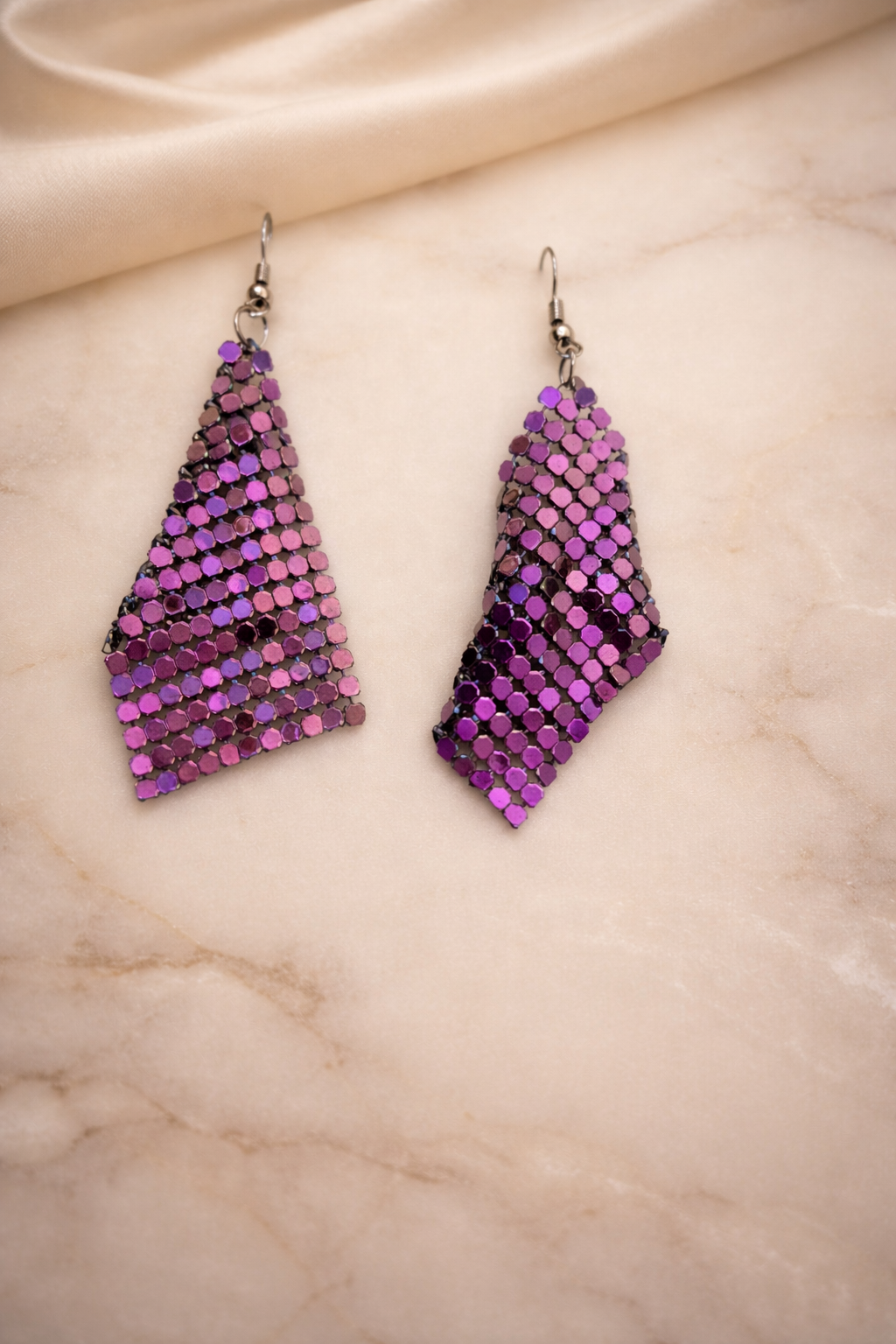 The earrings on a marble background 