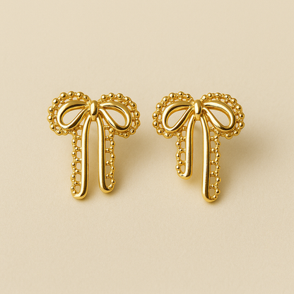 Velour Knot Earrings – elegant gold bow-shaped imitation earrings by Ora Haven, premium lightweight jewelry for everyday and festive styling.