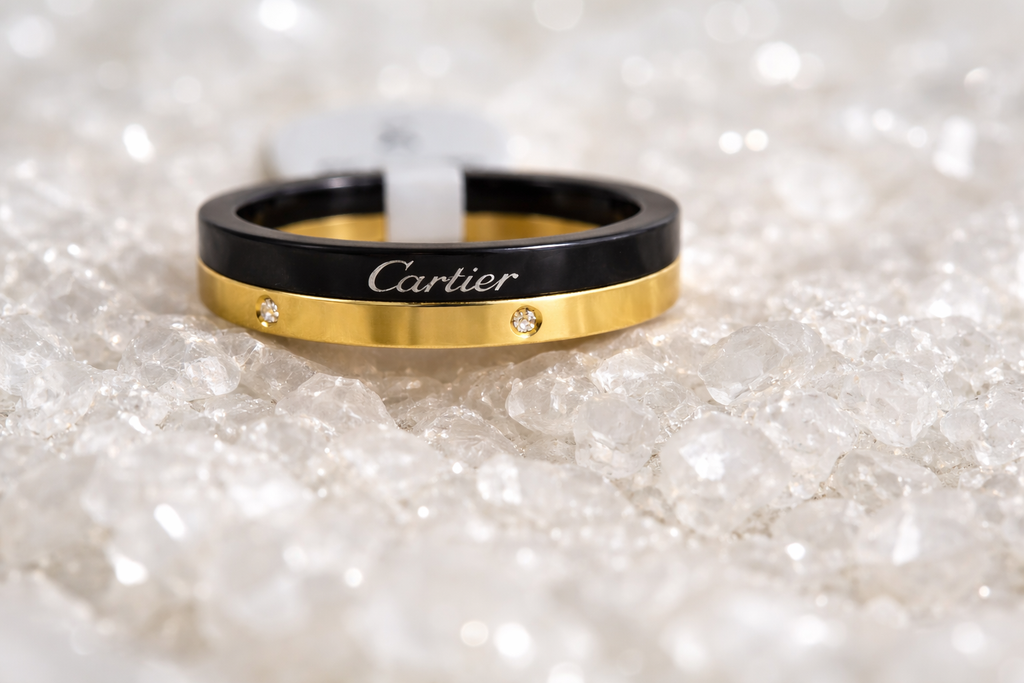 Cartier ring on a bed of white rocks.